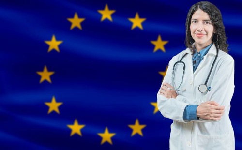 European Union medicine and healthcare concept Doctor close up against European Union flag