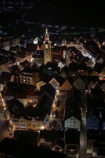 Illuminated city view at night with a church tower in the middle, Nagold, Calw district, Germany