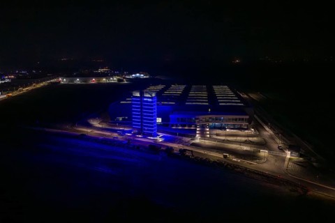 Factory at night with a characteristic blue-lit tower, Nagold, Calw district, Germany