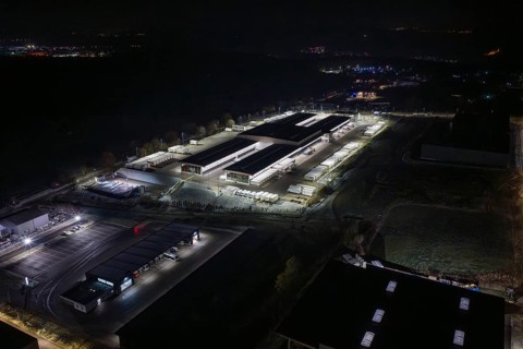 View of industrial area at night with illuminated warehouses and roads, Nagold, Calw district,
