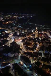 Panoramic view of a city at night with a brightly lit church tower, Nagold, Calw district, Germany