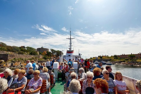 Group of tourists on ferry Ertholm, Danish passenger ship to Gutjem, ChristiansÃ¸, Christiansö,