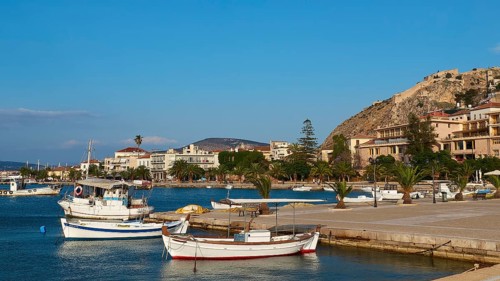 Nauplion Harbour, Palamidi Fortress, Two boats in the calm water of a picturesque coastal port,