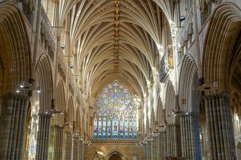View to west window, vaulted ribbed ceiling inside Exeter cathedral church, Exeter, Devon, England,