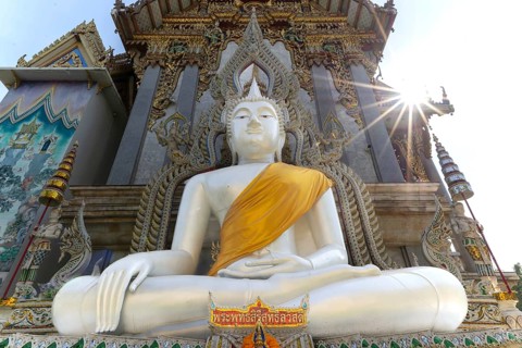 Buddha statue with tunic, Bhumispara mudra, Buddha Gautama at the moment of enlightenment, at the