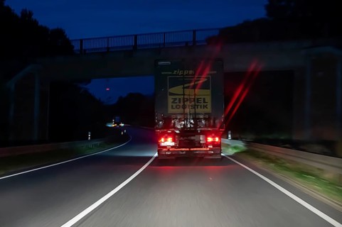 Braking truck on federal road at night, Schleswig-Holstein, Germany
