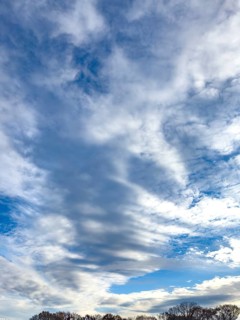 Cloud cover just in front of dusk with linear Altostratus clouds above it Cumulus mediocris with