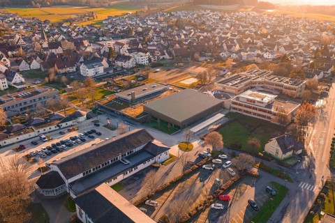 Village visible from above with sunset, roofs and surrounding landscape, Althengstett sports center