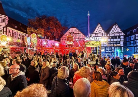 Many people at the All Saints Fair in the evening in front of half-timbered houses, Old Town,