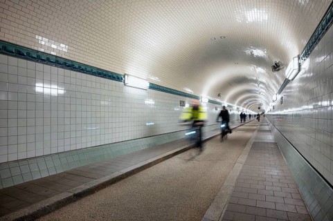 Interior view, pedestrians and cyclists crossing tunnel, mopping effect, movement, tube, historic