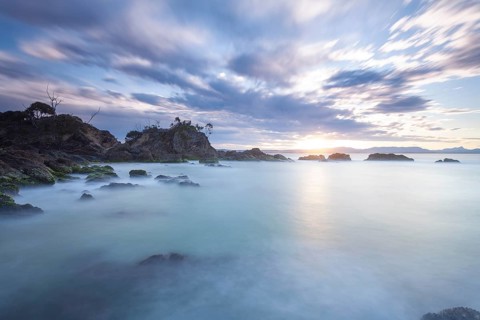 Sunset at Fisherman's Lookout. Dramatic waves and coastal scenery at The Pass, New South Wales,