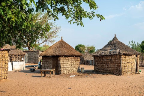 Typical village with mud huts, locals, Caprivi strip, Namibia