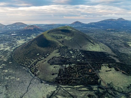 MontaÃ±a Negra volcano, picturesque volcanic landscape with volcanic crater at sunrise, Parque