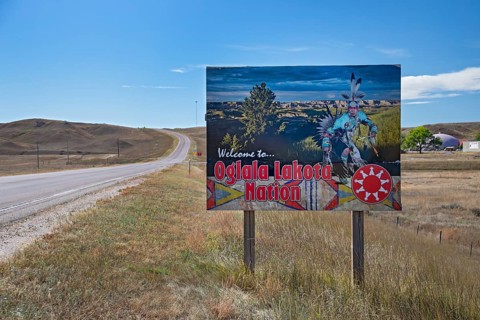 Red Shirt, South Dakota - A sign welcomes travelers to the Oglala Lakota Nation on the Pine Ridge