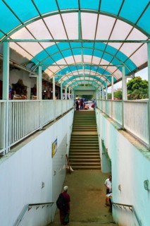 People using an underground passage protected by a veranda, Kandy, Sri Lanka