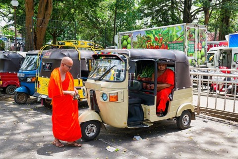 Buddhist monks talking near a tuk-tuk, Kandy, Sri Lanka