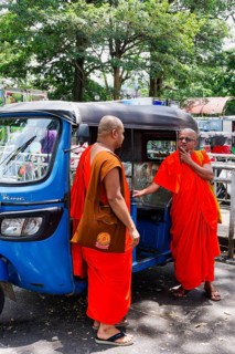 Buddhist monks talking near a tuk-tuk, Kandy, Sri Lanka