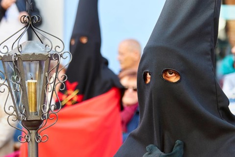 Good Friday procession, religious procession with participants in black robes, UNESCO World