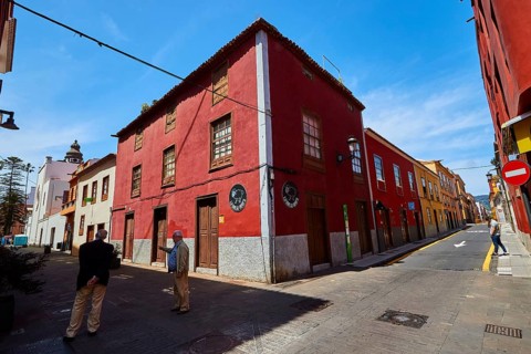 Historic street with red facades in sunshine, UNESCO World Heritage Old Town of San Crstobal de La