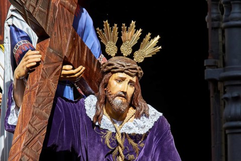 Good Friday procession, Jesus statue, with cross and crown of thorns, in purple robe, UNESCO World