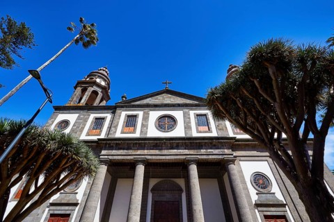 Nuestra Senora de los Remedios Cathedral, historic church with large arched windows and palm trees