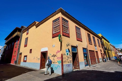 Corner with colorful historic houses and graffiti in bright sunshine, UNESCO World Heritage Old