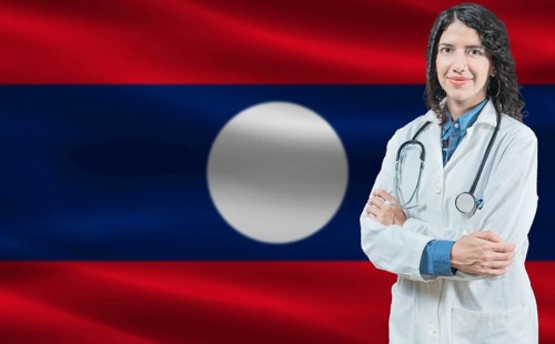 Laotian medicine and healthcare concept Doctor close up against Laos flag background