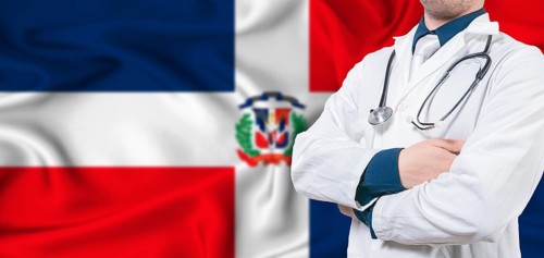 Dominican Republic healthcare concept. Male doctor on Dominican Republic flag. Doctor with crossed