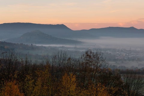 The majestic Teck Castle towers over the fog in the foothills of Alb. Aichelberg View of Teck
