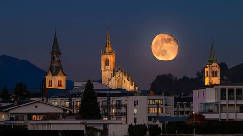 Hospital Church, Parish Church and New Bell Tower, just after full moon, Schwaz, Tyrol, Austria