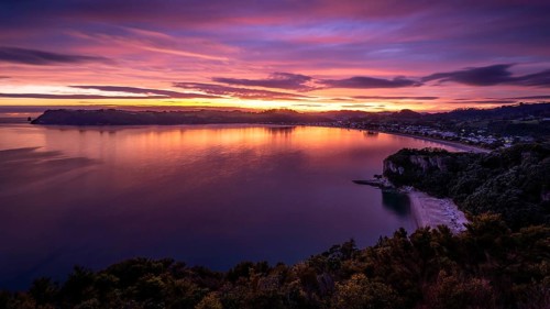 Landscape with sea and sandy beach in New Zealand. View of Lonely Bay and Cooks Beach from