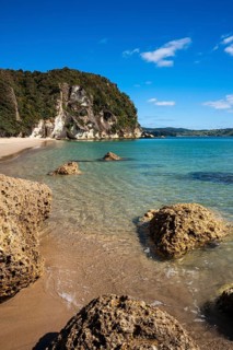 Landscape with sea, rocks and sandy beach in New Zealand. Lonely Bay, Shakespeare Cliff in the