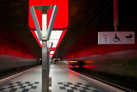 HafenCity University subway station, illuminated in color, red, underground train, movement effect,