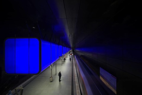 HafenCity University subway station, illuminated in color, blue, travelers, platform, stop, train
