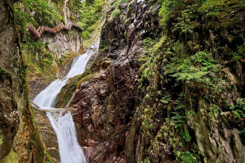 Wooden walkway next to waterfall in the Durnand Gorge, Les Valettes, Canton of Valais, Switzerland