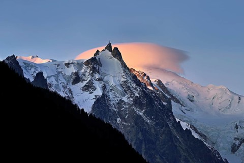 Aiguille du Midi with sun-lit cloud above the summit, Mont-Blanc, Chamonix-Mont-Blanc,