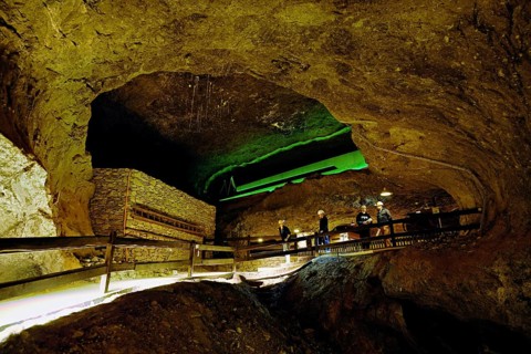Four people in a tunnel in a salt mine, salt mine, Bex, Canton of Vaud, Switzerland