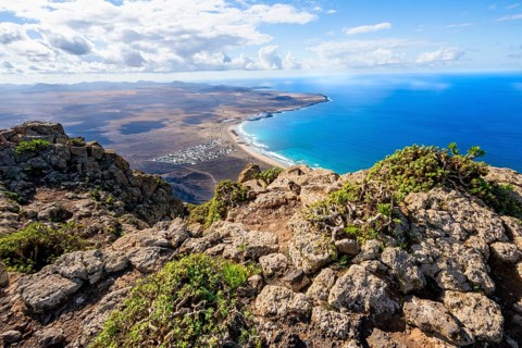 Castillejo viewpoint, view from the Risco de Famara cliffs to the coast and the sea with Famara