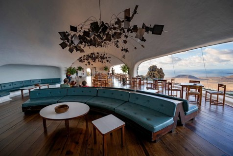 Sitting area with large sofa in the cafe with panoramic window, interior at the Mirador del RÃ­o