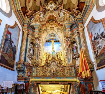 Interior of the historic baroque church of Bom Jesus de Matosinhos with the crucified Jesus and