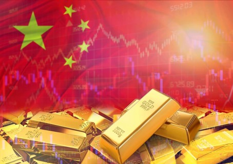 Gold bars on China flag in background. Gold bars stacked on Chinese flag. Concept of China gold