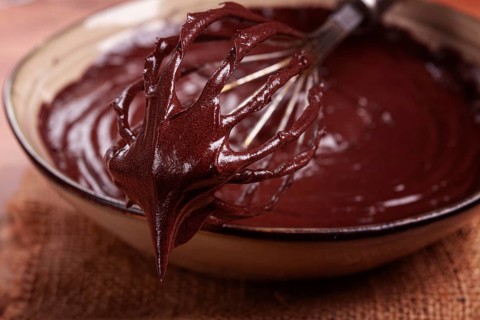 A bowl of chocolate dough, a whisk for whipping, baking, structure and consistency, homemade, top