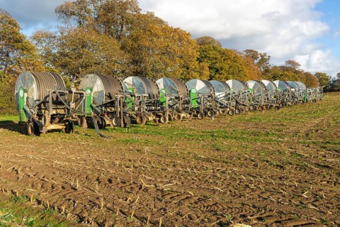 Rainstar E31 irrigation sprayer machinery in field, Shottisham, Suffolk, England, UK