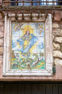Historic ceramic tiles religious image above doorway, medieval village of AlbarracÃ­n, Teruel