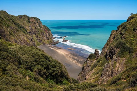 Landscape in New Zealand with sea and sandy beach. View of Mercer Bay. Mercer Bay Loop Walk hiking