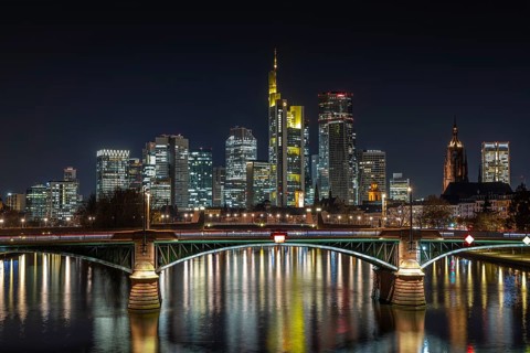 The lights of Frankfurt's banking skyline glow in the evening, Frankfurt am Main, Hesse, Germany