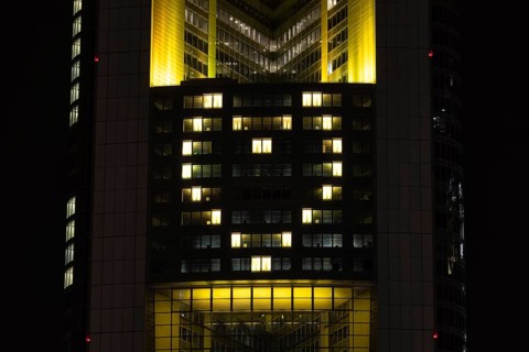 Lights inside the offices project a glowing yellow heart onto the faÃ§ade of the Commerbank Tower