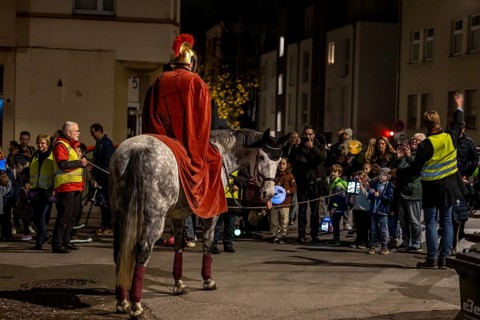 Martinszug in Essen-RÃ¼ttenscheid, the parish of St. Lambertus, Saint Martin actor on a horse, with