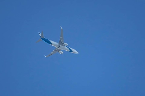 Boeing 737 jet passenger aircraft of El Al Israel airlines flying in a blue sky, England, United