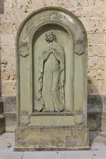 Old gravestone in front of St Martin's Church, catholic church, graceful female figure, relief,